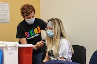 Park County Public Health nurse gives sophomore Emma Short Pfizer’s COVID-19 vaccine at the vaccine clinic held at the high school on April 28.