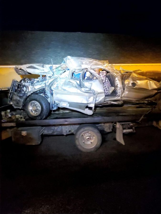 Tyler Englands mangled truck is loaded up and taken from the crash site Sep.19.