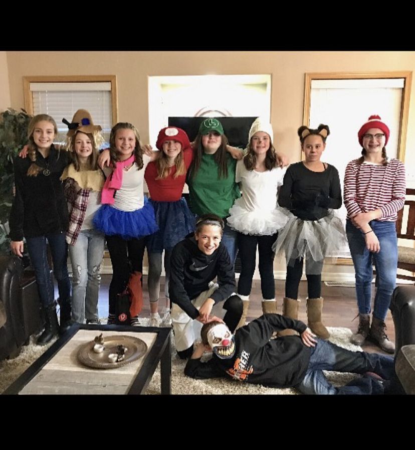 (from left) PHS sophomores Anna Bartholomew, Taryn Feller, Jordyn Dearcorn, Alexis Terry, Lily Morrison, Gracie Trotter, Raven Tobin, Sydney Spomer, Harrison Paul, and Morgan Hobbs are dressed up to go trick-or-treating for the 2017 Halloween season. 