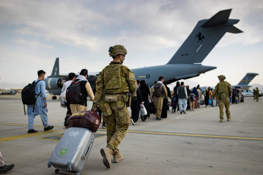 U.S. Army soldiers walking off a plane, returning home from a nine-month deployment to Afghanistan on Dec. 10, 2020.