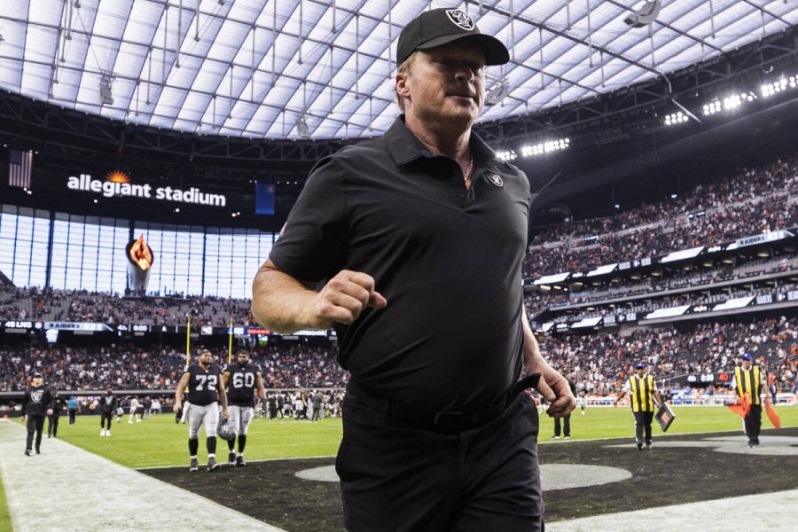 Former Raiders head coach Jon Gruden leaves the field in what would be his last game before resigning on Oct. 11.