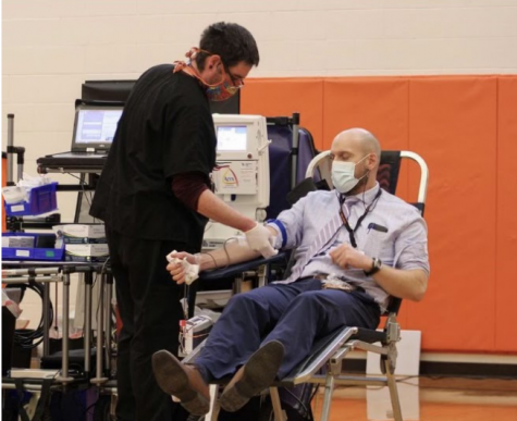 PHS Principal Mr. Tim Wormold is getting his blood drawn for the 2020-2021 NHS-Vitalant Blood drive. 