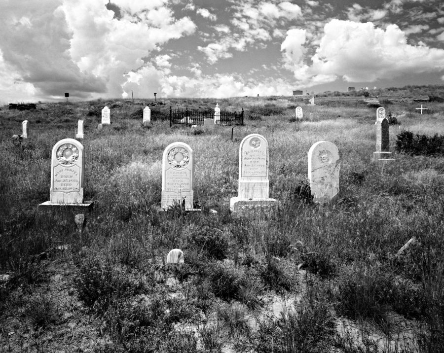 Graves+at+the+Carbon+Cemetery+in+Carbon%2C+Wyoming+sit+beneath+a+cloudy+sky.+Carbon+Cemetery+was+one+of+the+first+established+graveyards+in+Wyoming%2C+remaining+long+after+the+town+was+reduced+to+a+ghost+town.