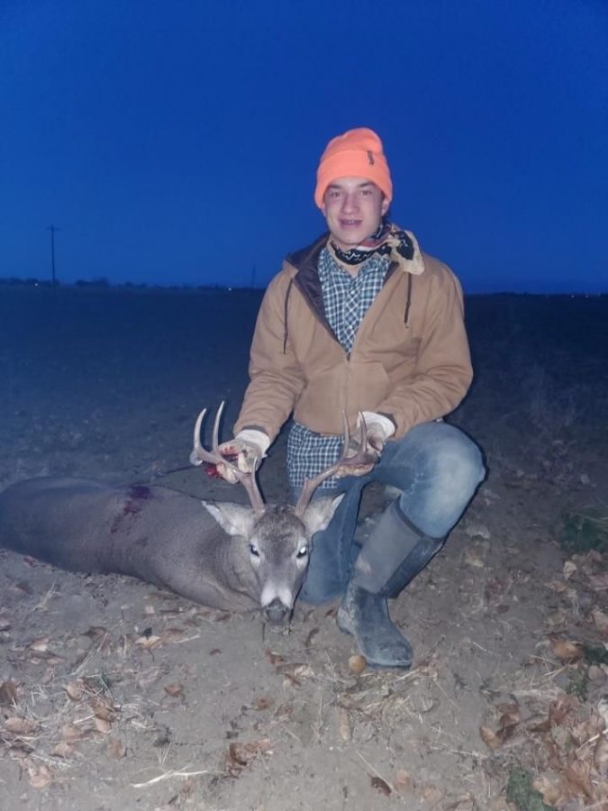 PHS freshman Zane Graft poses with one of his whitetail bucks. The buck was harvested in Deer Area 121, which is Mule Deer Chronic Waste Disease positive.