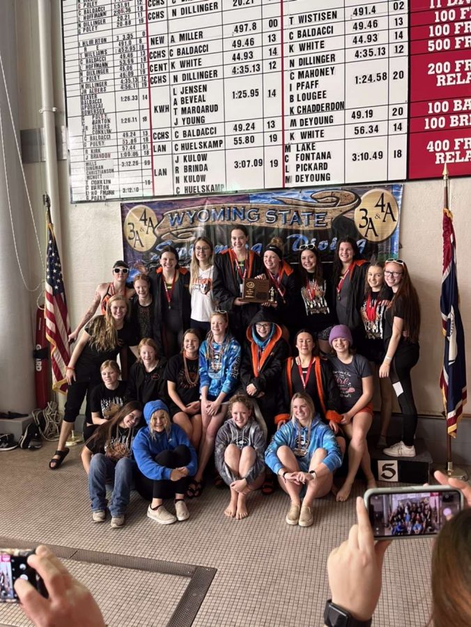 The Lady Panther swim and dive team stand on the podium after placing third at the 3A state championship.