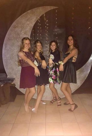 Juniors Hannah Hincks, Taryn Feller, Alexis Terry and Grace Coombs pose together at the 2019 PHS Winter Formal