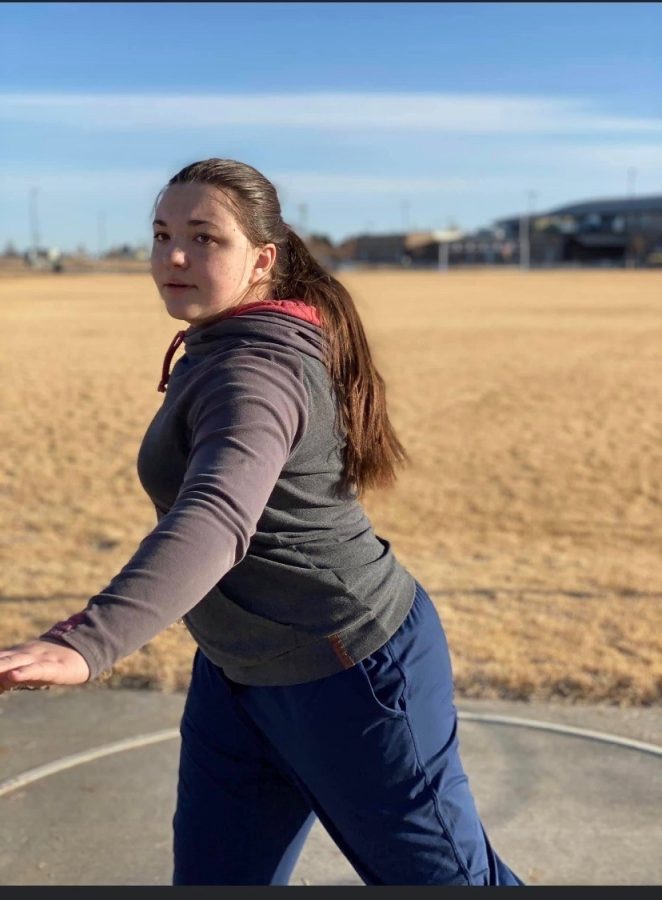 PHS sophomore Brooke Bessler practices the discus throw for outdoor track.