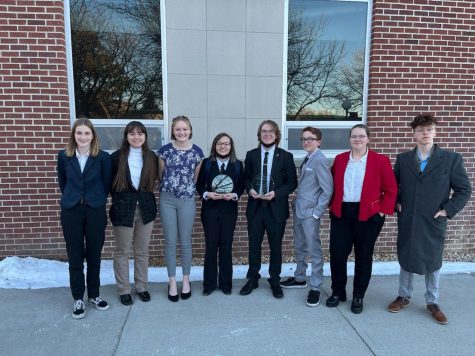 The Speech and Debate team brought home two trophies commeriating their hard-fought win at the first varsity tournament of the season on Jan. 8. 
From left, freshman Salem Brown, sophomore Emma Johnson, sophomore Liz Peterson, junior Dacovney Brochu, senior Aiden Chandler, freshman Paul Cox, freshman Isabelle Lobinger and junior Ethan Cearlock.