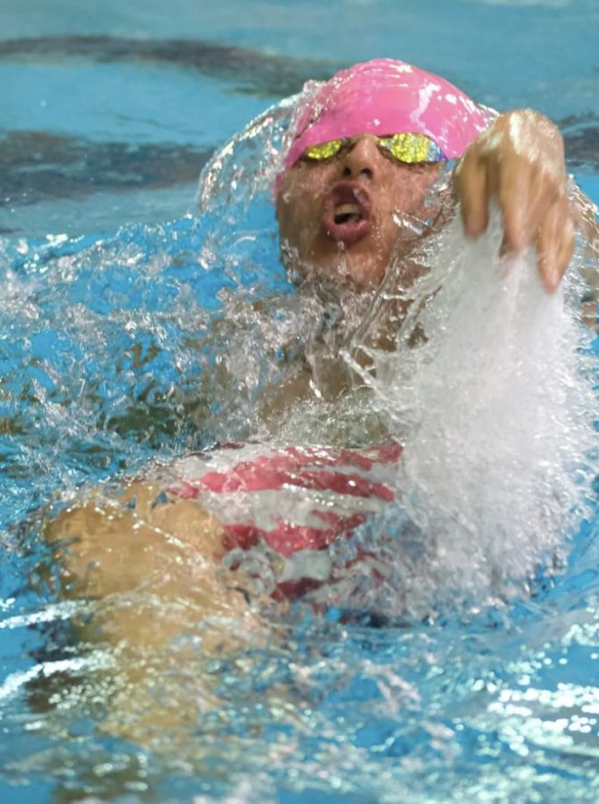 Rocky Mountain junior Rui Parker swims backstroke at the state meet. Parker placed fourth in the 100 yard backstroke. 