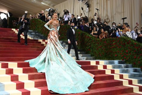 This year’s Met Gala host, Blake Lively, reveals the color change in her dress on the red carpet.
