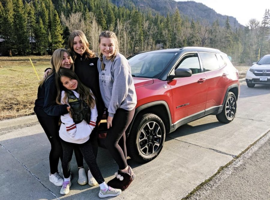 The McIntosh daughters, plus family friend Kenzie Clarkson, smile for the camera before entering Yellowstone.