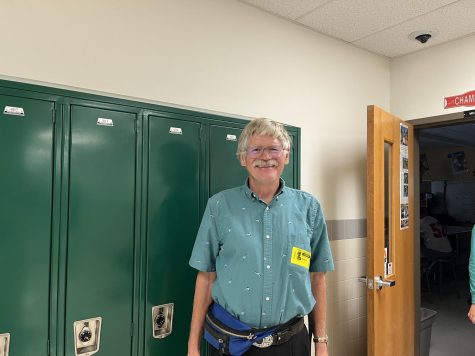 Mr. Raimer smiles for the picture as he steps outside of the Foods classroom, one of the many classes he substitutes for. 