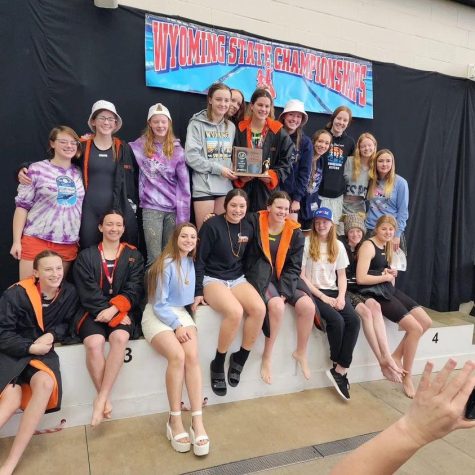 The Lady Panthers stand on the podium together after taking third place at the Girls 3A State Swim and Dive Championship.
