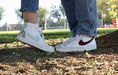 PHS graduates Lily Halter and Bryce Hogan stand toe to toe wearing their Nike Blazers. Nike Blazers are a popular, trendy shoe. 