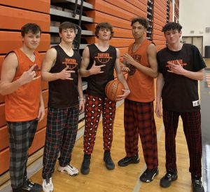 Varsity basketball boys participate in the Pajama Dress Up Day for Make-A-Wish Week by wearing pajama pants during practice that night. 