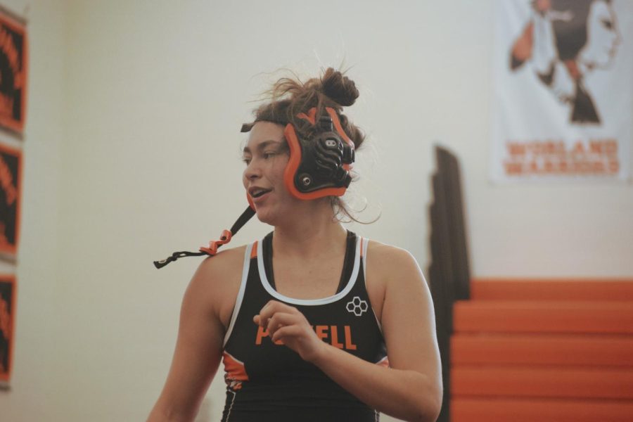 PHS Senior Yesenia Teague unlatches her headgear after pinning her opponent in the home-hosted dual. 
