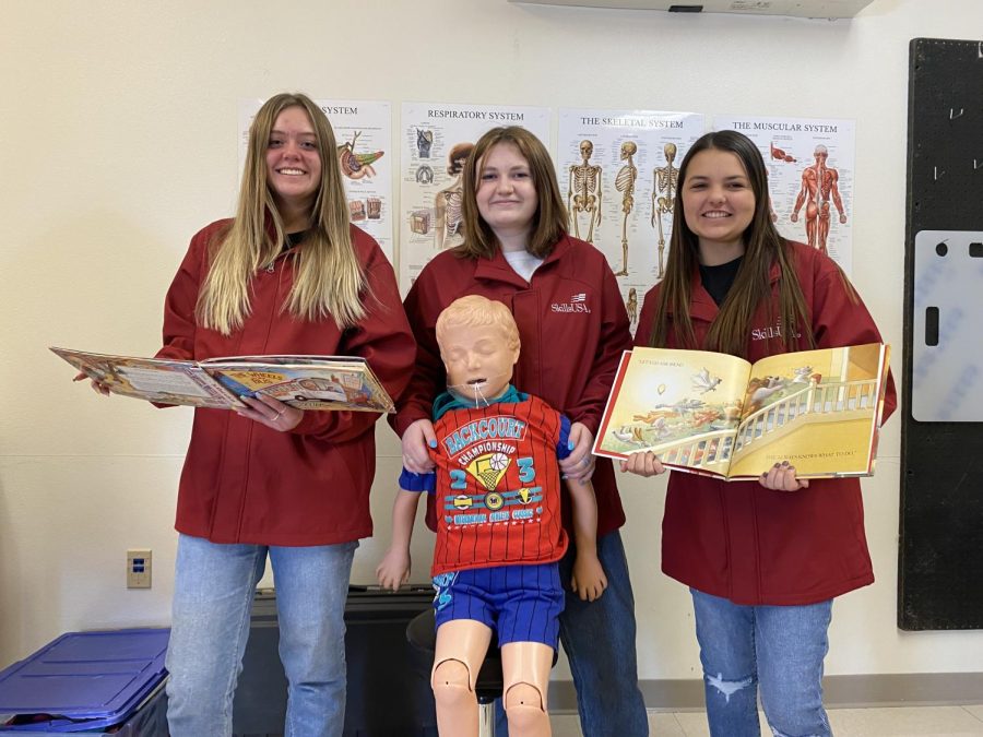 SkillsUSA+competitors+sophomore+Ava+Stearns%2C+junior+Elle+Wilson%2C+and+sophomore+Kendal+Eden+show+their+new+jackets+to+wear+in+this+years+competition.