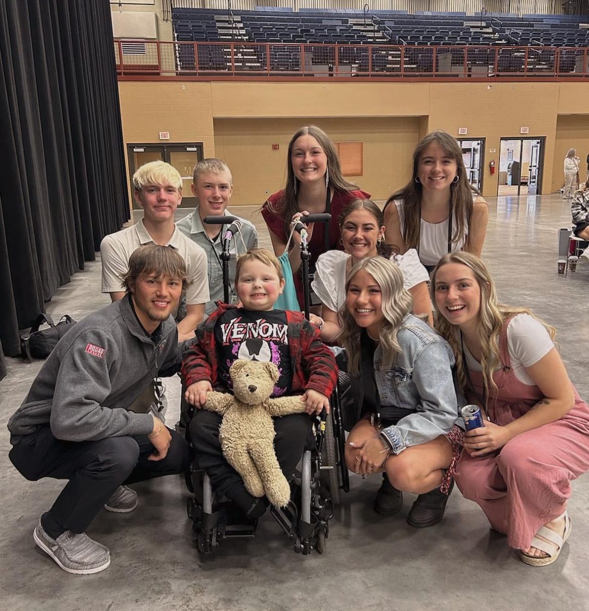The Executive Board of the Wyoming Association of Student Council pose with Carter, a young boy personally moved by the funds of the Make-A-Wish organization in Wyoming.  