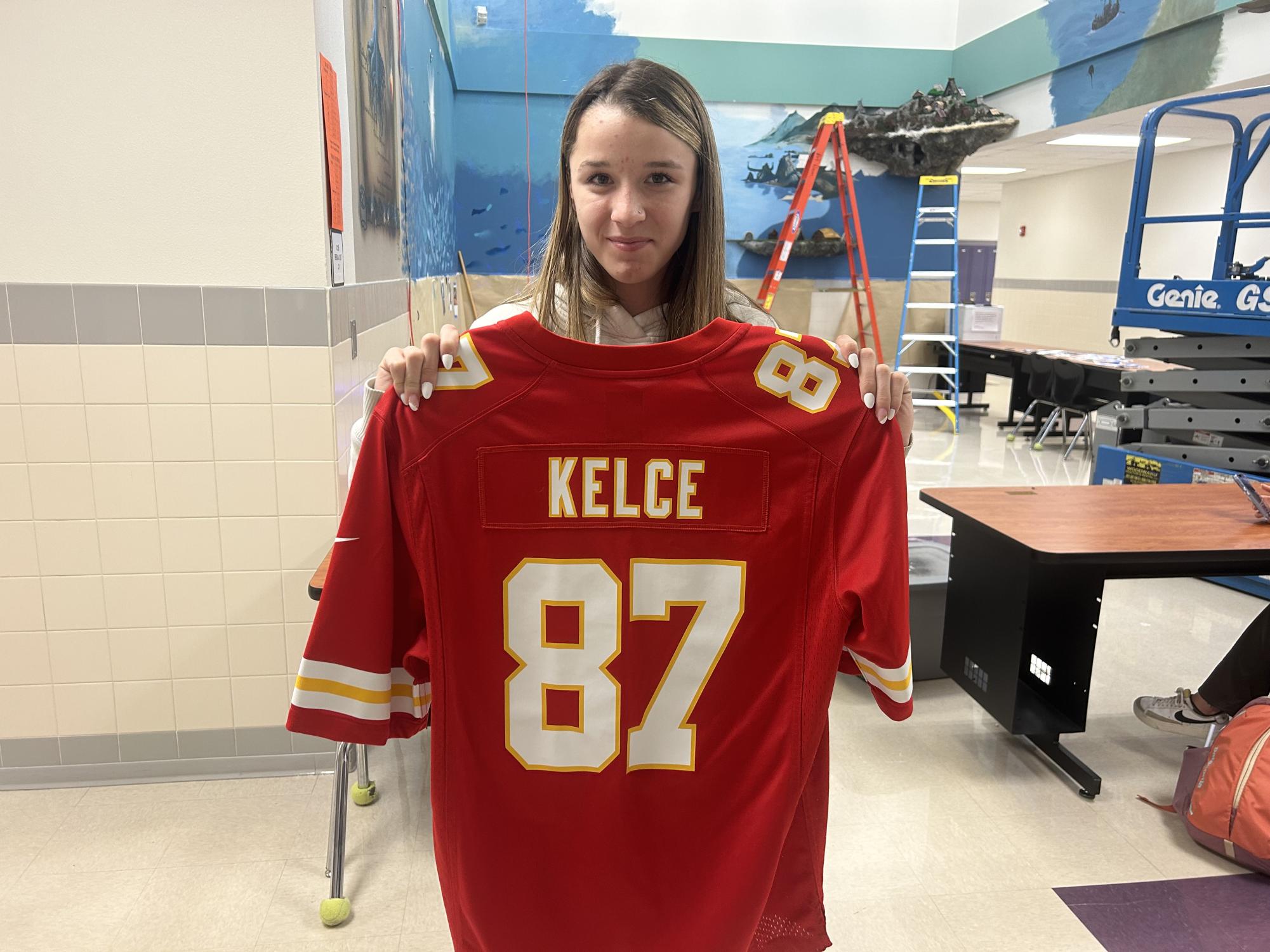 A PHS Swiftie holds up Travis Kelce’s jersey. 