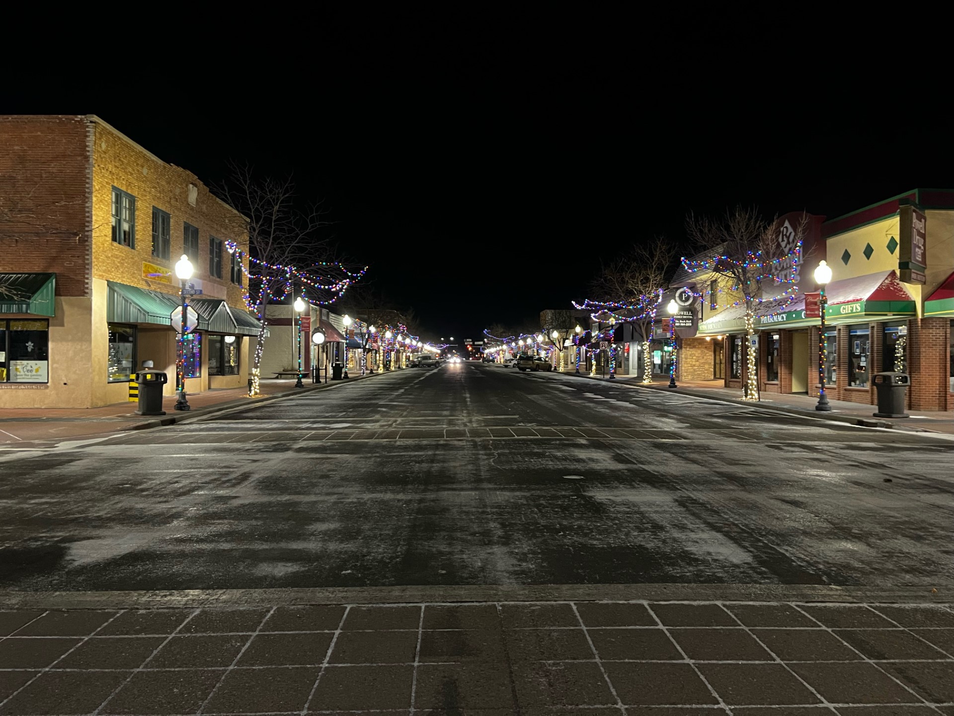 Downtown Powell, decorated for Christmas, at night. 