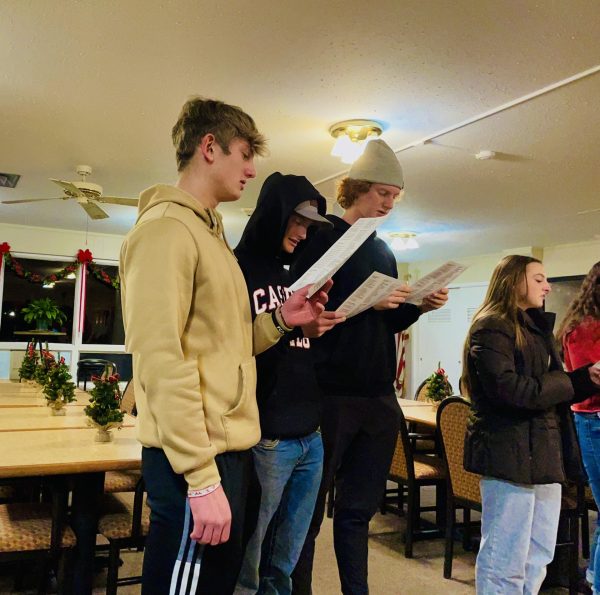 National Honor Society Members sing carols to the residents at the Heartland Assisted Living Center. 