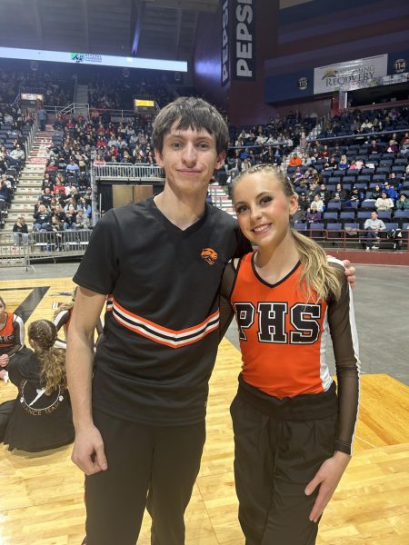 Kolby Crichton and Anna Smith pose for a picture while waiting for team results.