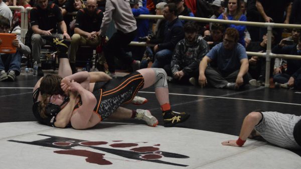 Jimmy Dees pinning his opponent for his hundredth win.
