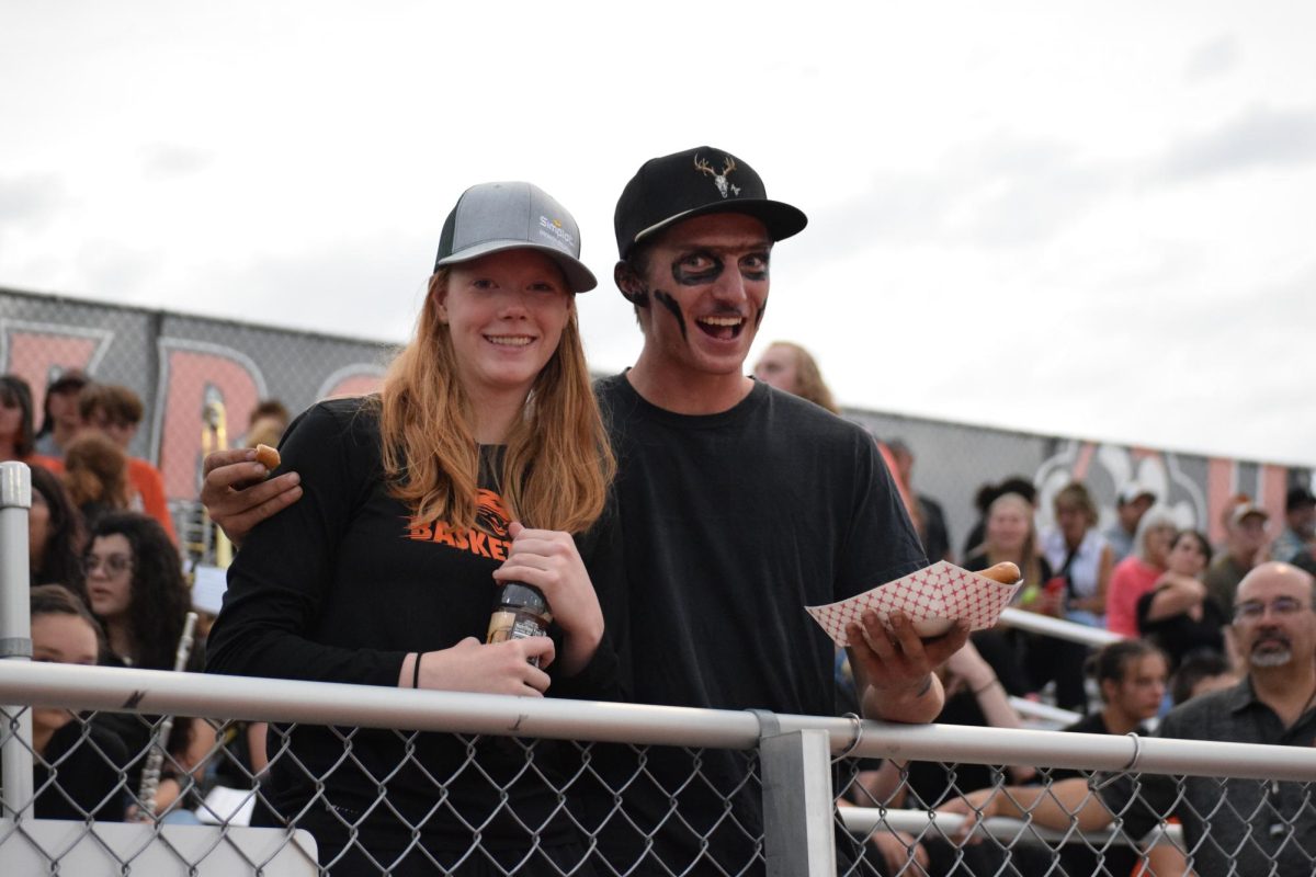 Some facial paint is used by senior Wyatt Heffington and companion Charlee Brence.
