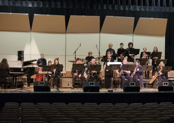 The jazz band practices for its performance.