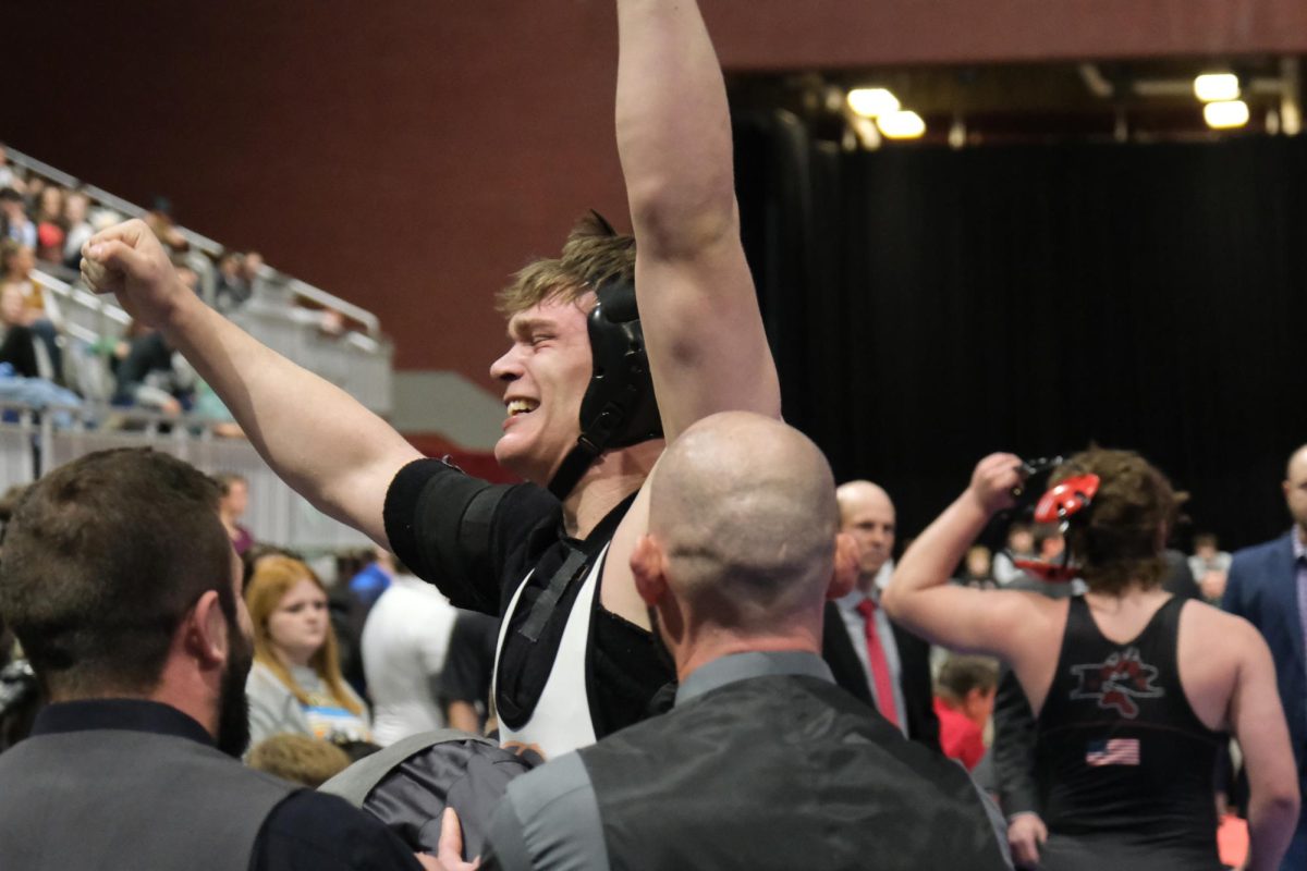 State wrestling champion Jimmy Dees celebrates his momentous win at Casper, WY.