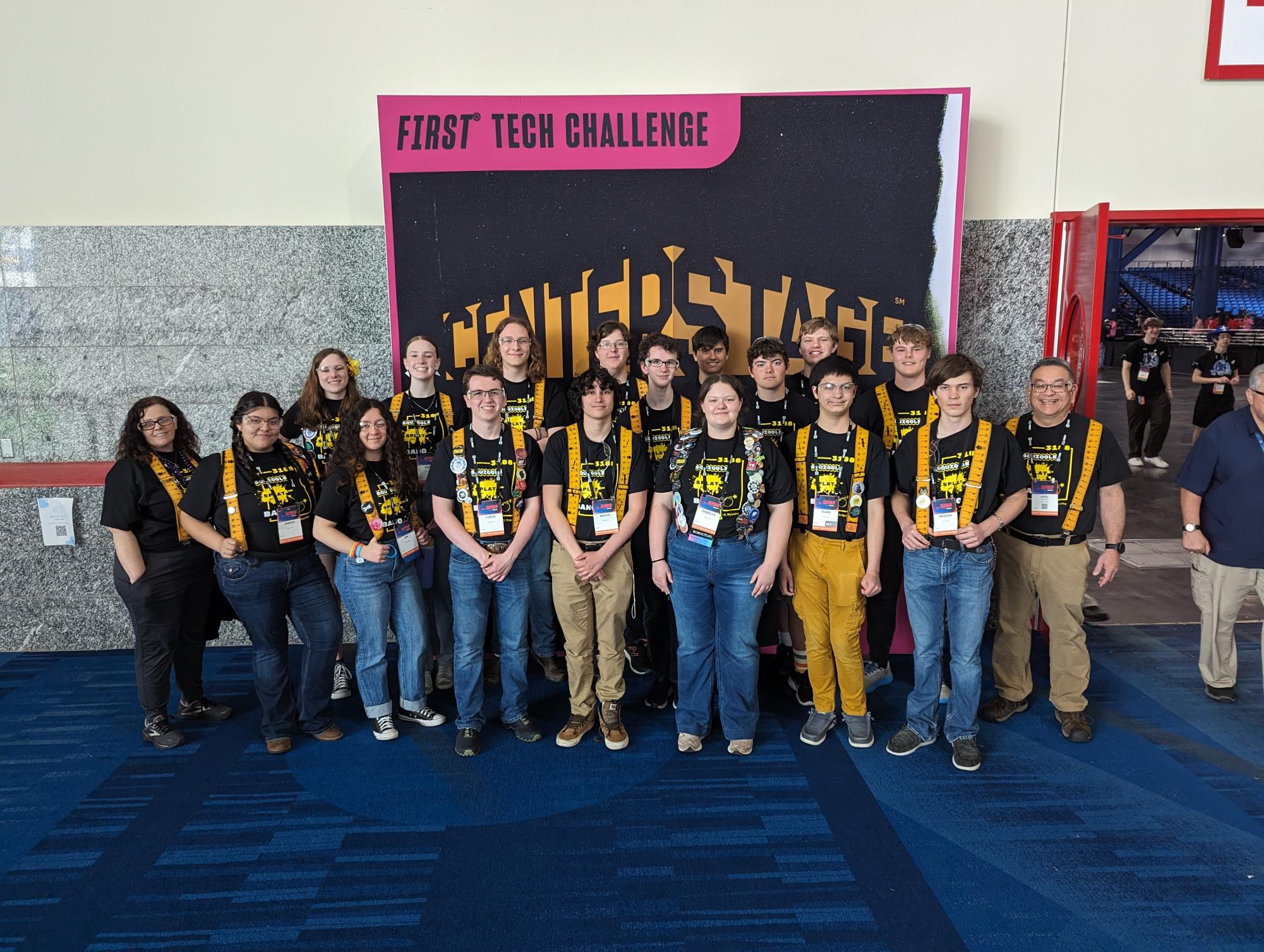  Powell High School robotics club members stand in front of FIRST Tech Challenge 2024 backdrop in Houston, Texas, at Worlds.
