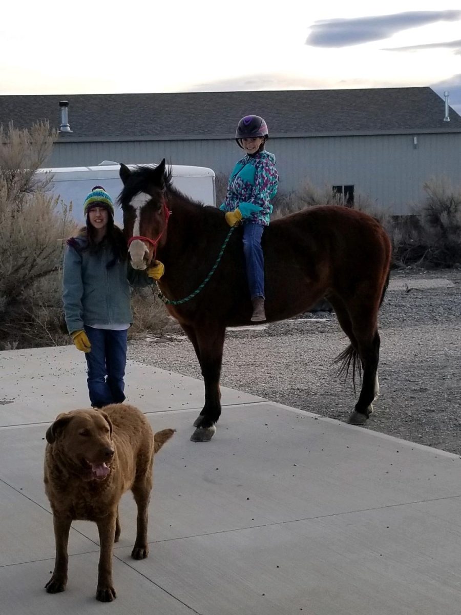 
Shelbey Zickefoose leads her childhood best friend, Emma Sapp, on her horse.