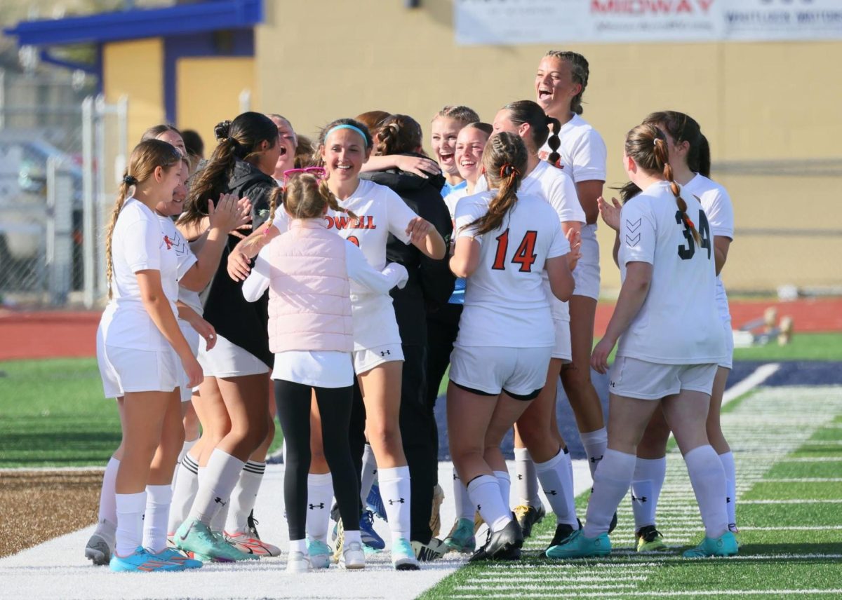 The Girls’ soccer team celebrates after their noteworthy achievement over Cody.