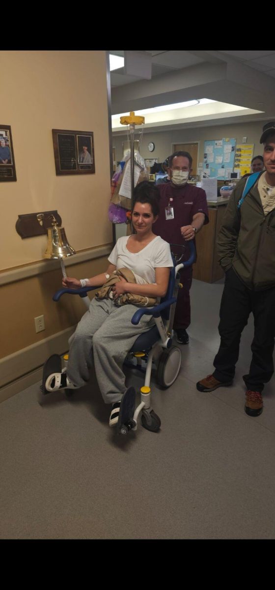 Sasha Barrus rings the bell after undergoing surgery to remove her kidney.