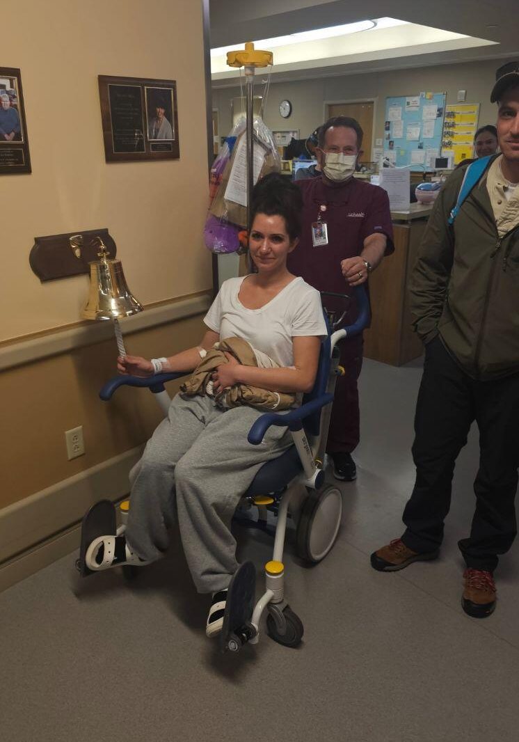 Sasha Barrus rings the bell after undergoing surgery to remove her kidney.