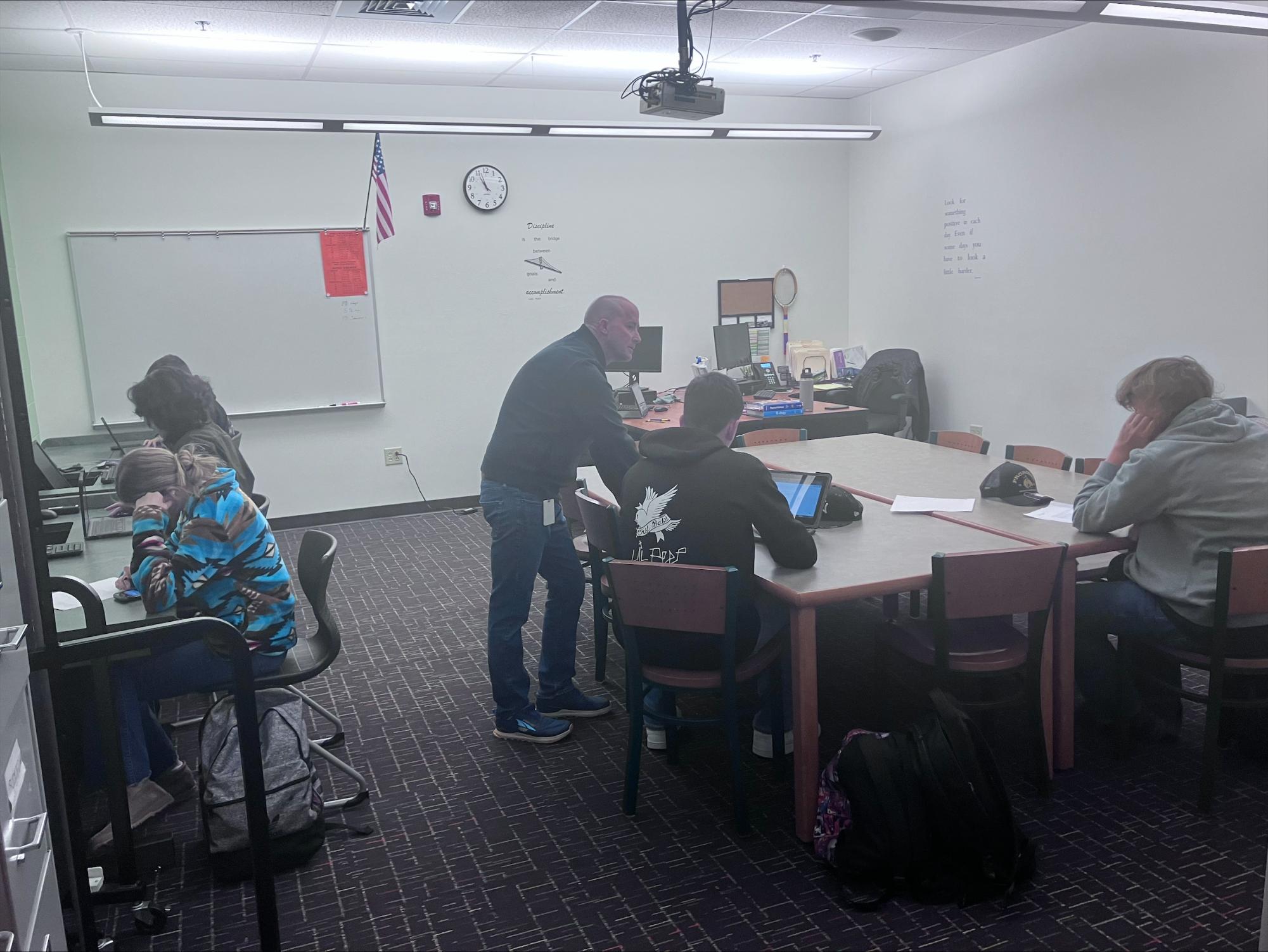 Students try to finish their missing assignments in Mr. Quigleys room.