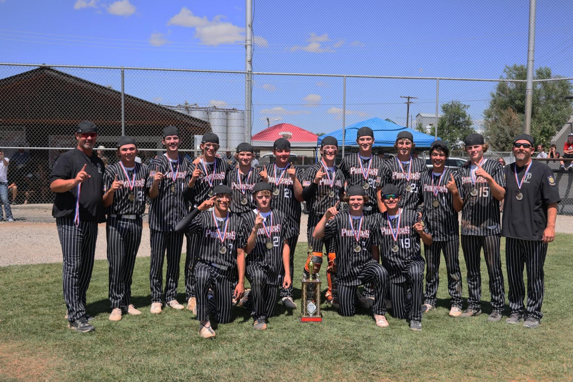 The Powell Pioneers pose with the trophy for the second time in two years.