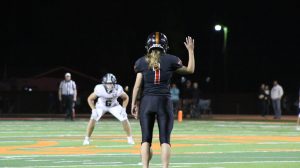 Junior Ivy Agee raises her right arm, signaling that she’s ready to kickoff.