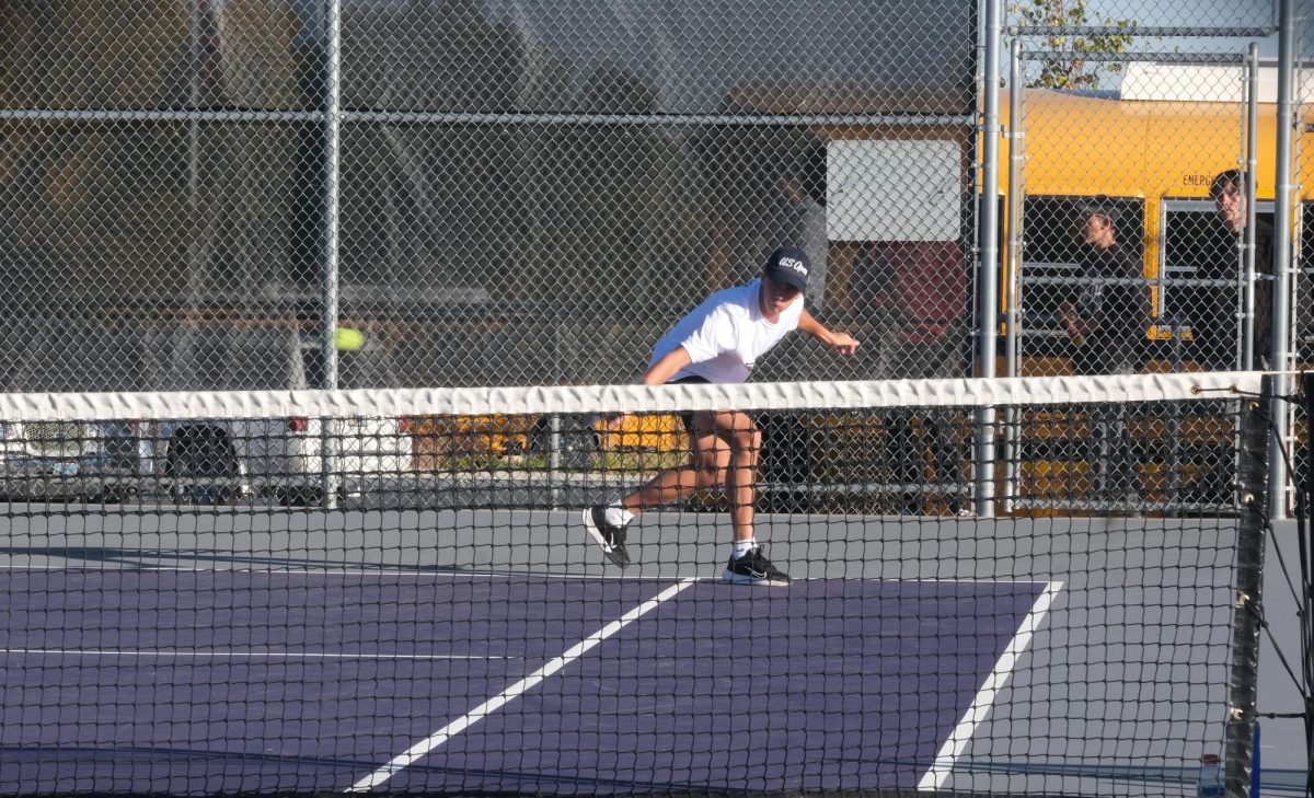  Nathan Preator hits a backhand shot during one of his many tennis matches.