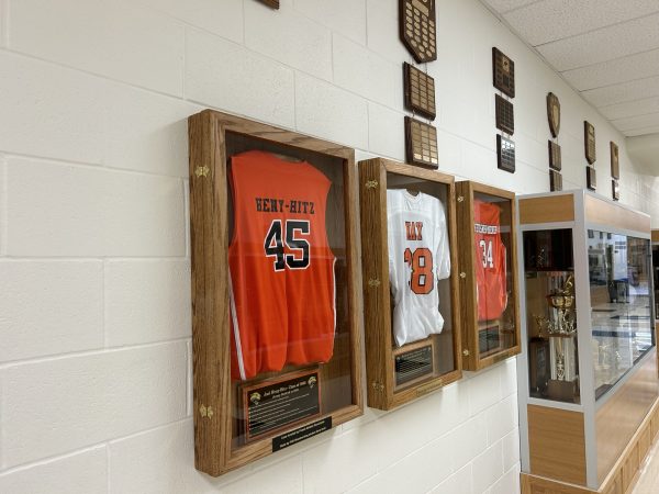 Powell High School’s honorary athlete's jerseys are hung throughout the trophy hall.