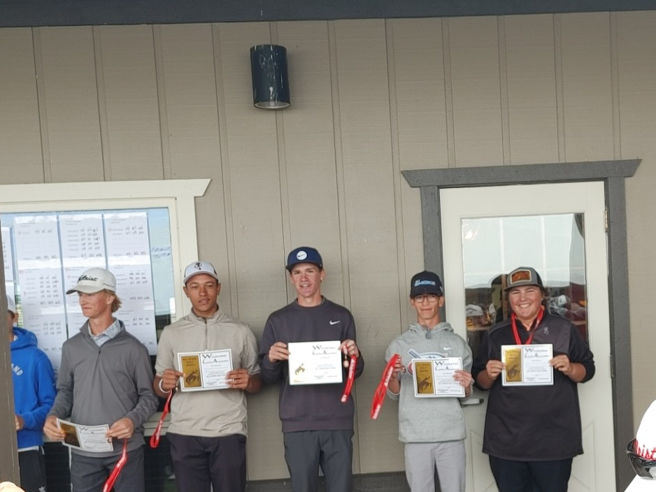 Senior Trey Scott (very right side) lined up with his All-State medal after the second day.