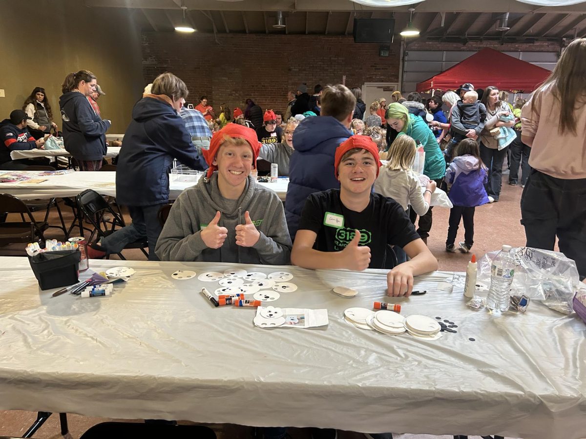  Brighton Streeter and Calvin Opps pose during a short break between crafting with the kids.