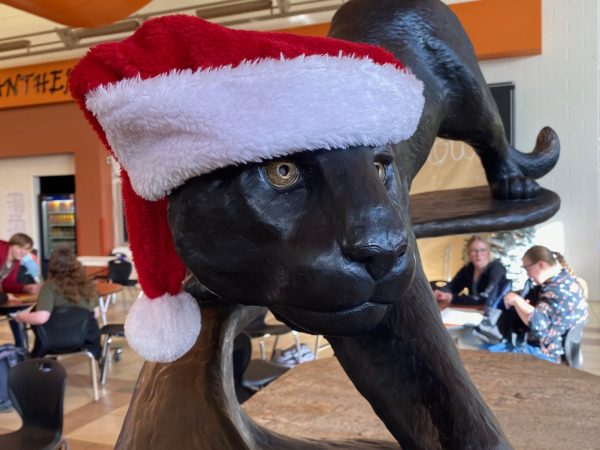  In the front lobby of the school, the panther has been given a Santa Hat