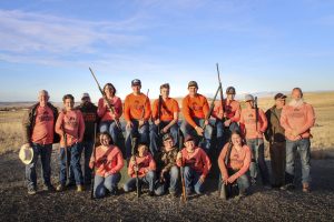 The Clay Target Team gathers together for a team photo with their shotguns.