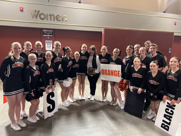 PHS Cheer squad celebrates with their coach Vicki Walsh after winning coach of the year.