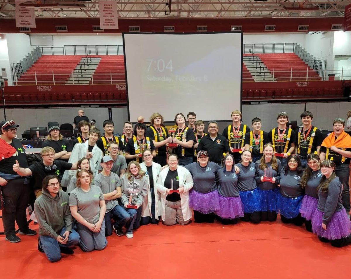 Powell High School robotics teams pose with their awards after the competition.