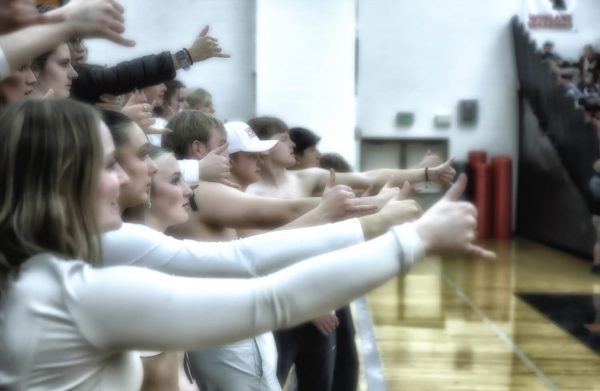 Students hold their breath in anticipation of a free throw shot at the Cody vs. Powell basketball game on January 23.