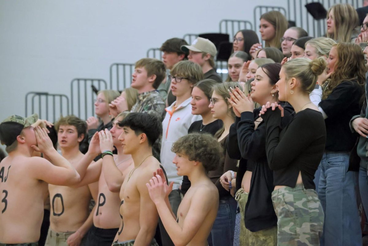 Senior Trevon Abraham leads the student section in a cheer.