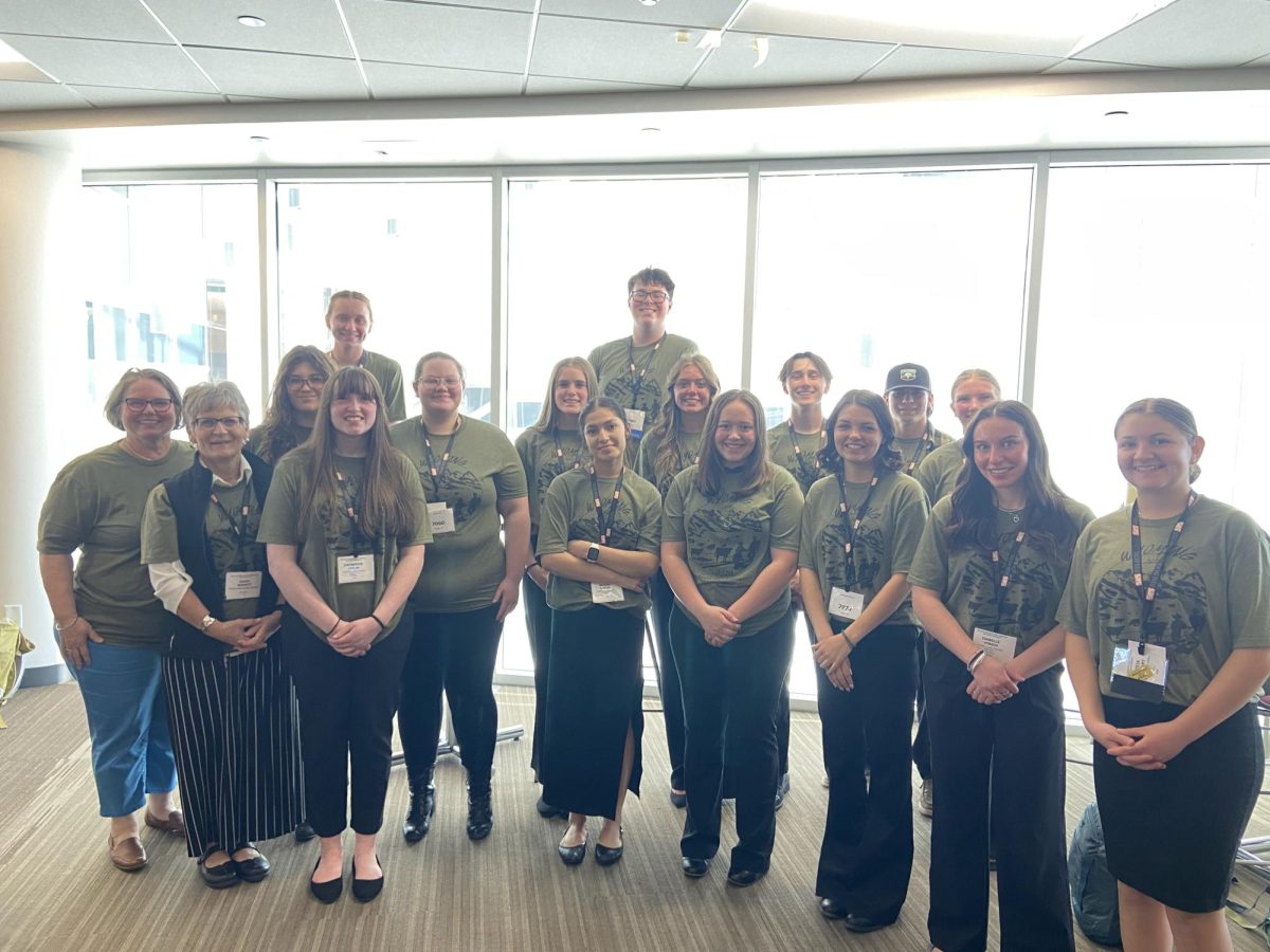 Powell High School SkillsUSA members pose for a group photo before continuing to compete.