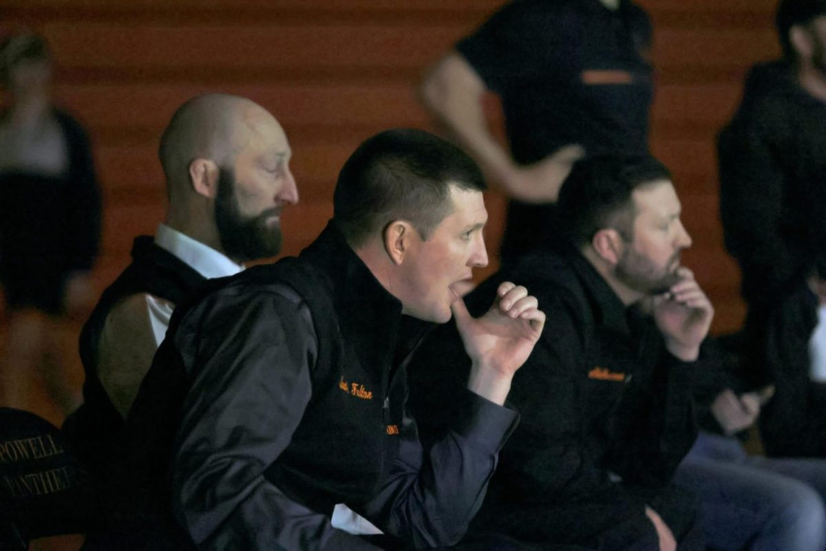 Wrestling Head Coach Nick Fulton shouts out to a competitor during their match.
